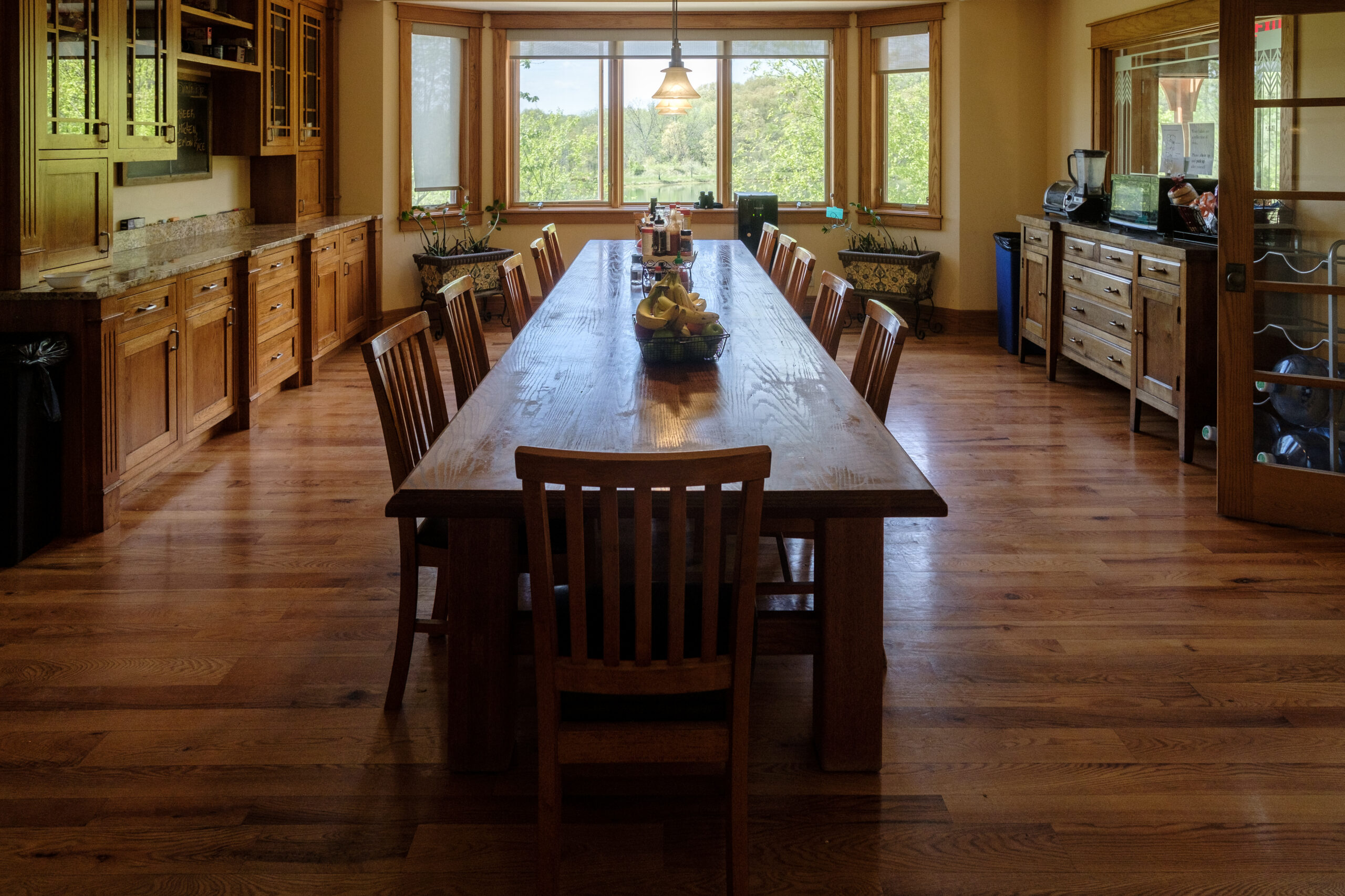 Spacious dining area with tables and natural views at Top of the World Ranch residential treatment center, promoting shared meals and community building during holistic rehab.