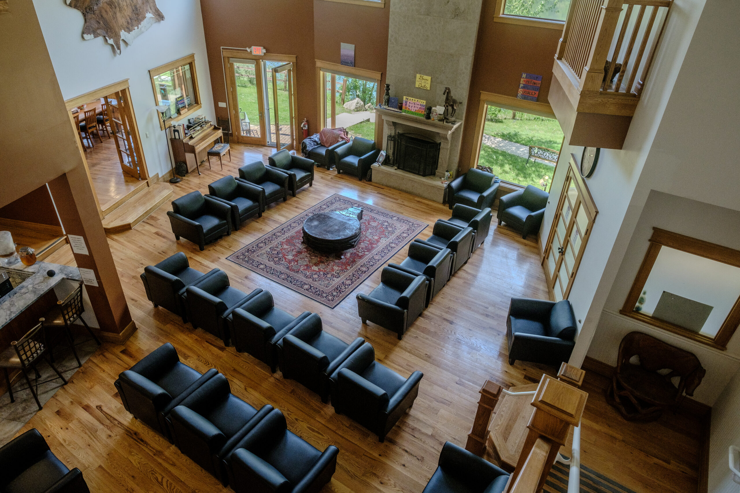 Inviting great room in the Main Lodge at Top of the World Ranch Milan IL, a cozy gathering space for relaxation, reflection, and social connection during addiction recovery.