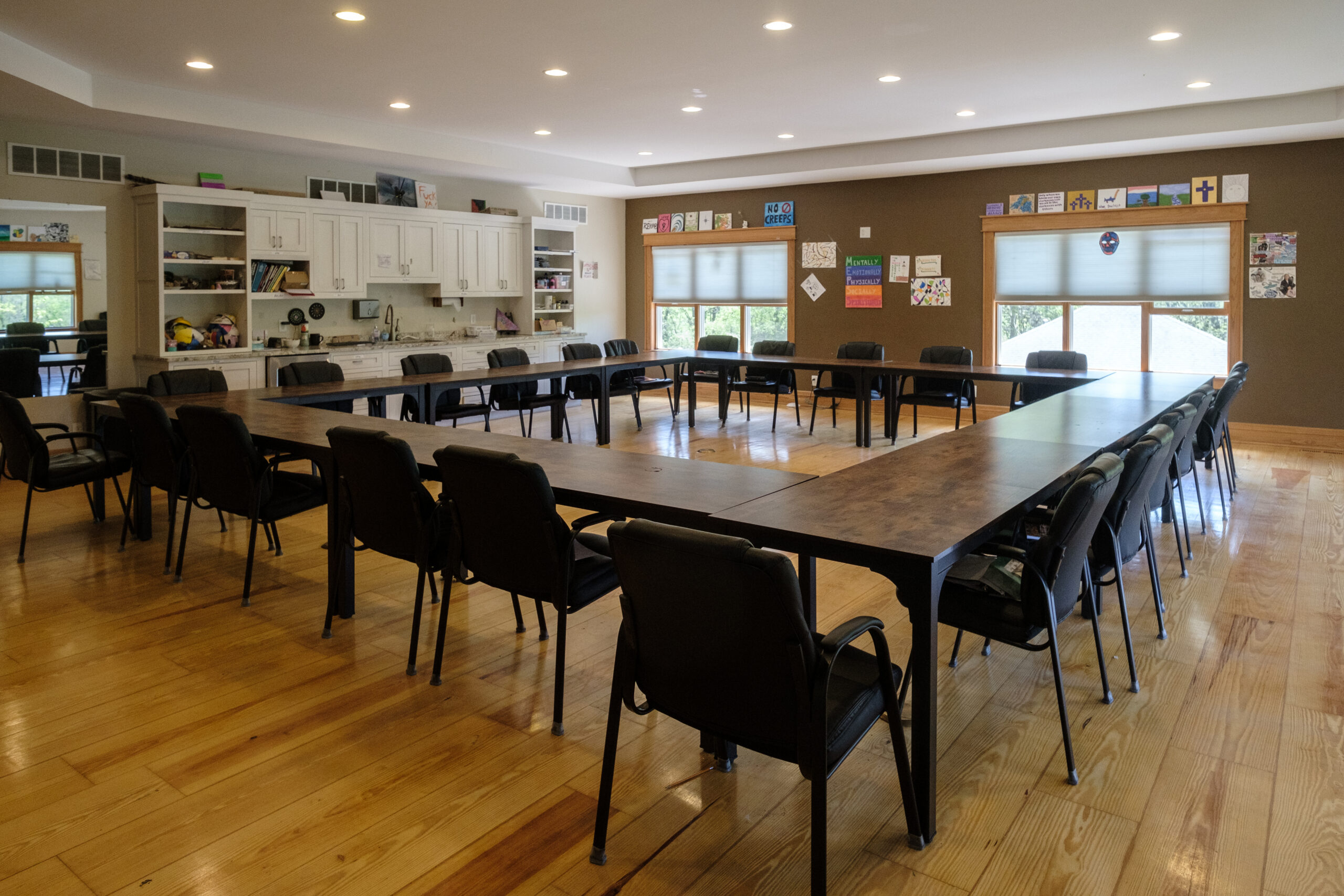 Spacious group therapy room in the Main Lodge at Top of the World Ranch addiction rehab Milan IL, ideal for supportive group sessions, sharing circles, and community healing.