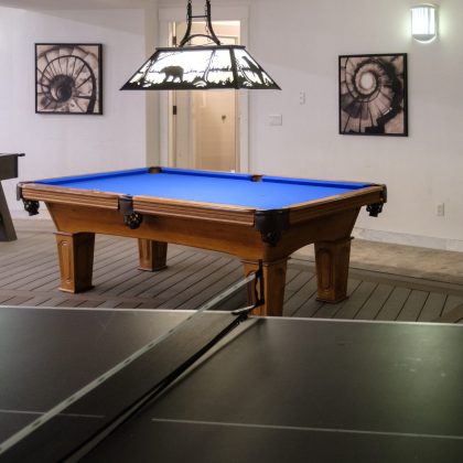 Pool table in the games room at Top of the World Ranch Milan IL residential rehab, part of recreational amenities including billiards for leisure and social engagement during treatment.